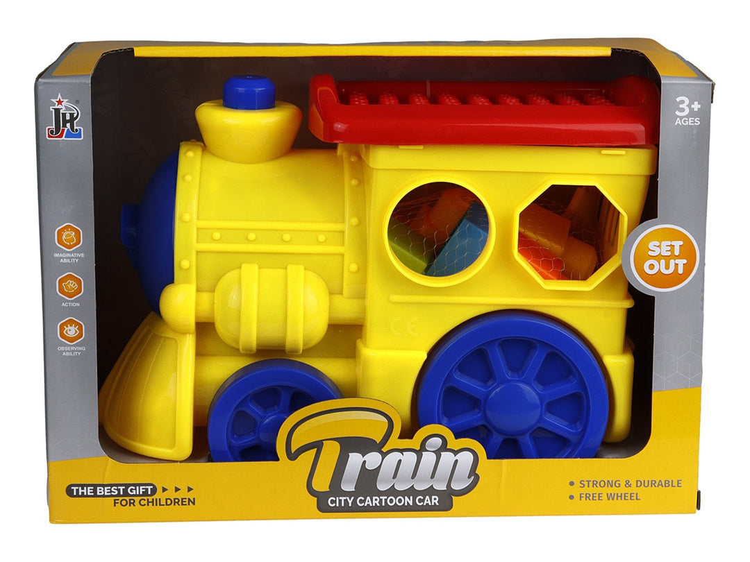 Tren de juguete amarillo con detalles en azul y rojo, incluye bloques internos, presentado en su empaque original.