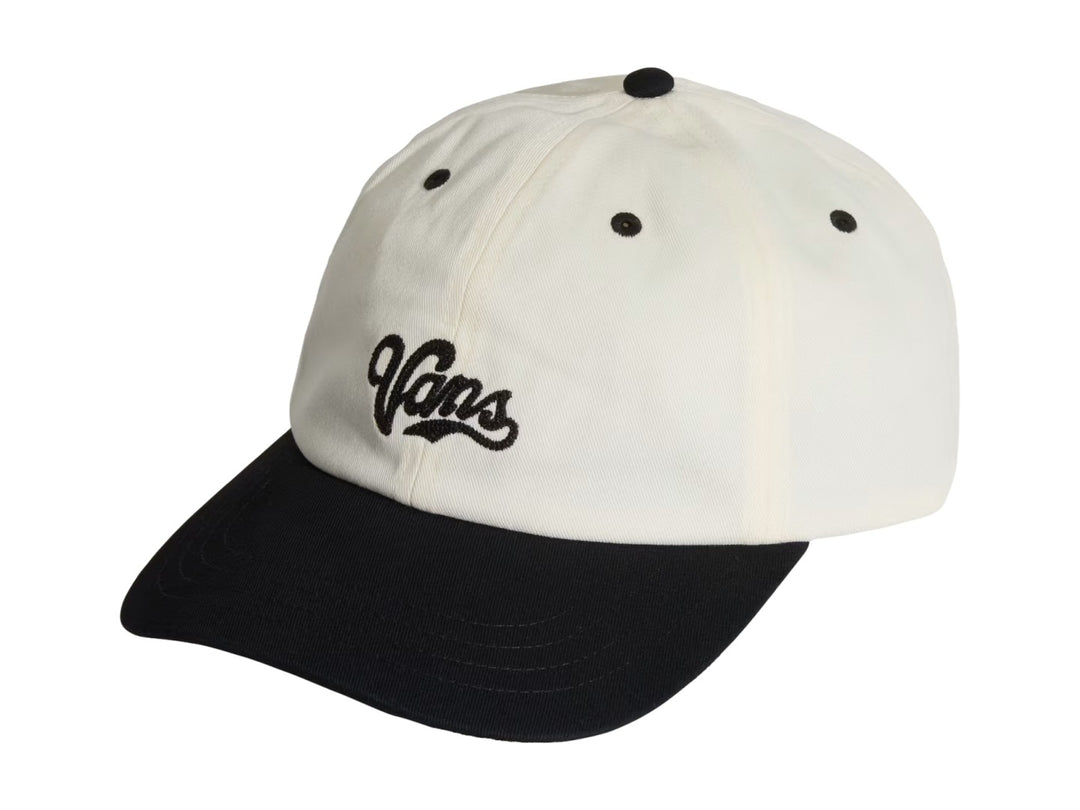 Gorra Vans blanca con visera negra y logotipo Lefty Script bordado en negro en el frente.