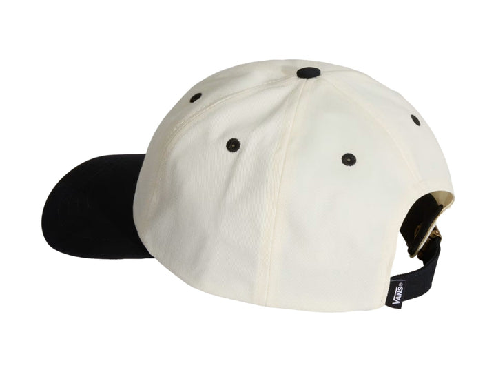 Gorra Vans blanca con visera negra y logotipo Lefty Script bordado en negro en el frente.