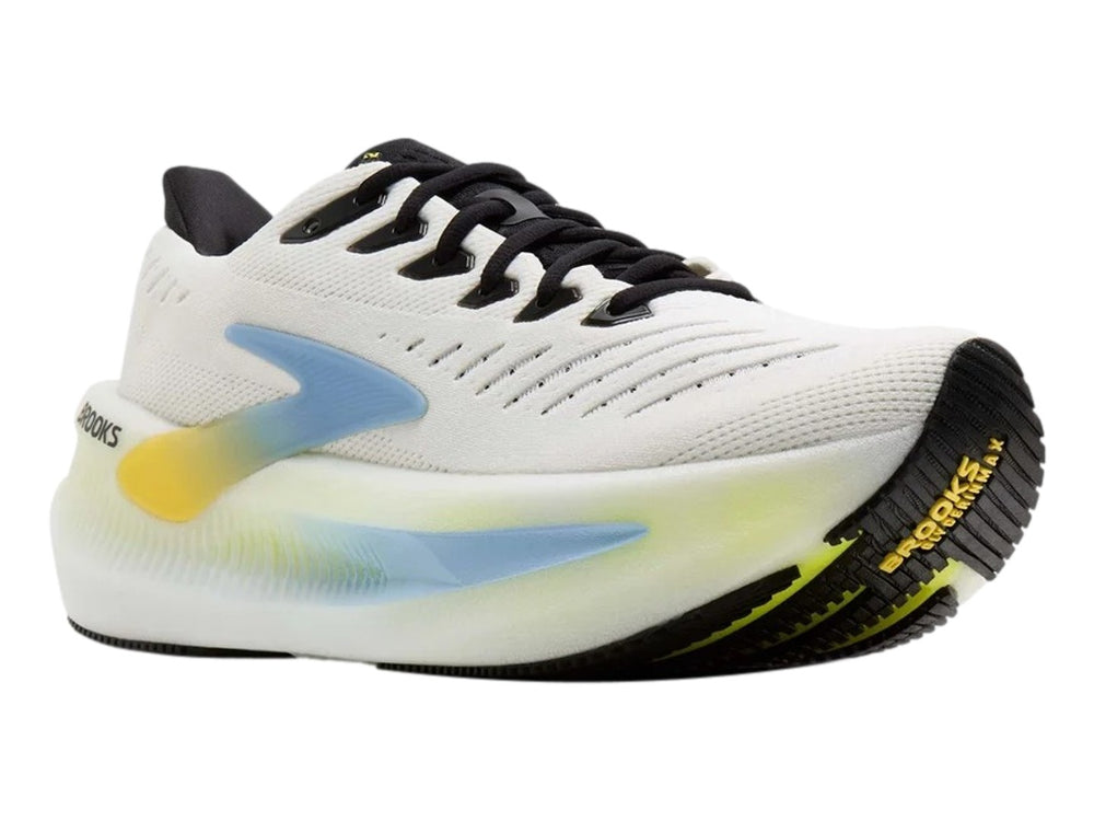 Tenis Brooks Glycerin Max 2 en color blanco con detalles degradados en azul y amarillo y agujetas negras.