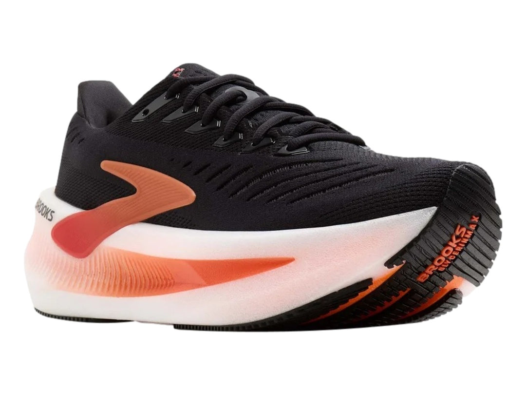 Tenis Brooks Glycerin Max 2 en color negro con detalles en naranja y suela blanca gruesa.