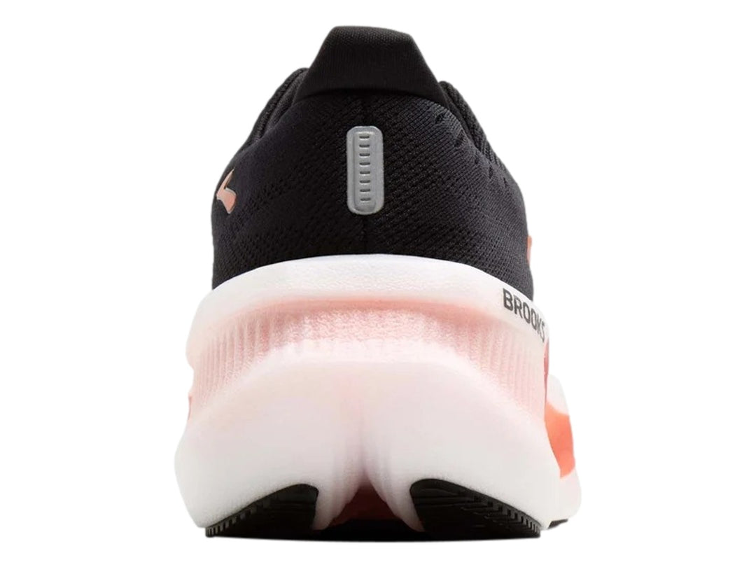Tenis Brooks Glycerin Max 2 en color negro con detalles en naranja y suela blanca gruesa.