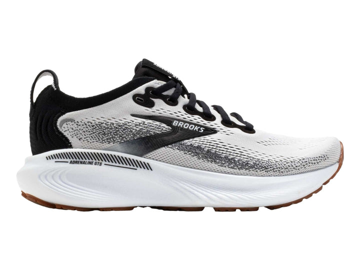 Tenis Brooks Adrenaline GTS 25 en color blanco con detalles en negro y suela blanca y café.