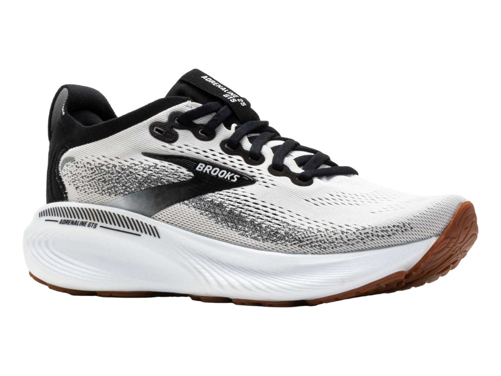 Tenis Brooks Adrenaline GTS 25 en color blanco con detalles en negro y suela blanca y café.